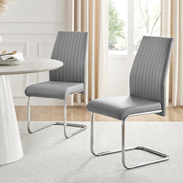 Canora Grey Loren Faux Leather Dining Chairs with Chrome Legs ...